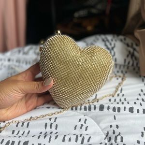 Gold sparkly heart shaped purse
